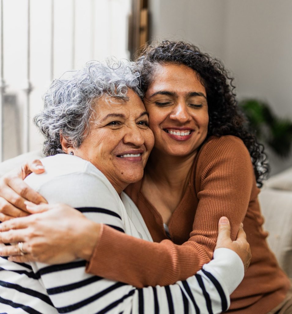 Mother and daughter embraced at home