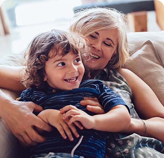 Grandmother hugging grandson