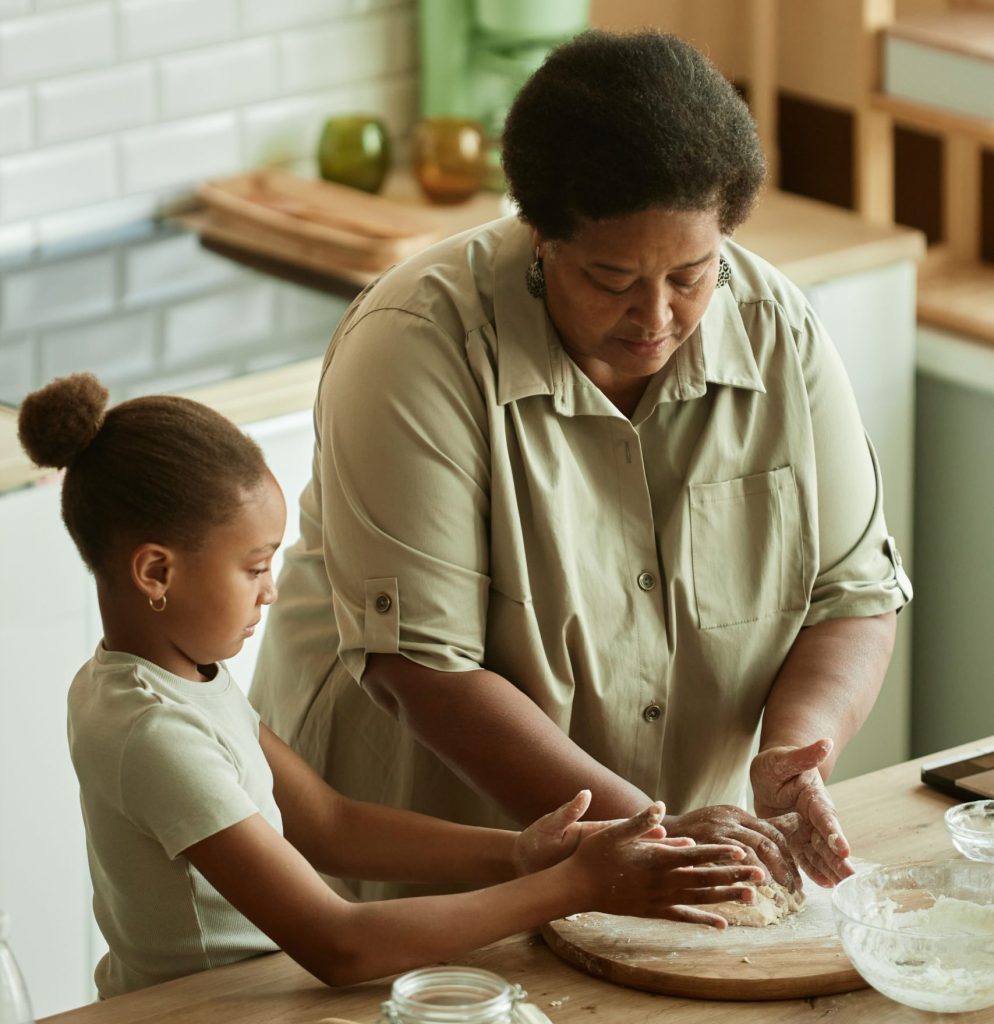 Caregiver baking with child