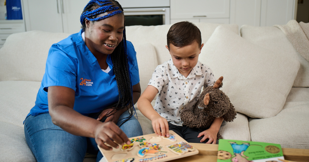 A care provider and child read a book together - five ways to find a care provider in your network.