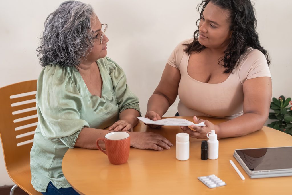 ECM lead coordinator meeting with senior to support her health and housing needs